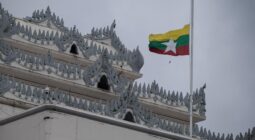 Myanmar's national flag flutters at half-mast outside the City Hall in Yangon. AFP