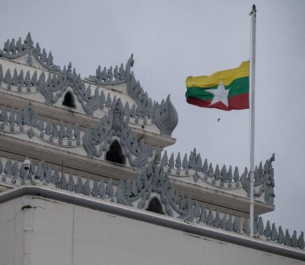 Myanmar's national flag flutters at half-mast outside the City Hall in Yangon. AFP