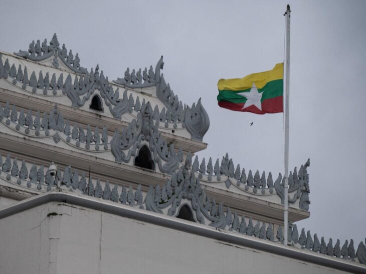 Myanmar's national flag flutters at half-mast outside the City Hall in Yangon. AFP