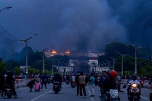 Demonstrators set fire to the Parliament building in Kathmandu. (Photo by Ambir Tolang / NurPhoto via AFP)
