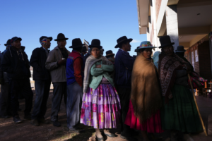 Voters stand in line at a polling station during general elections in Jesus de Machaca, Bolivia, Sunday, Aug. 17, 2025. (AP Photo/Juan Karita)