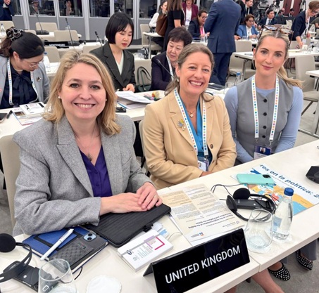 Rt Hon Dame Karen Bradley DBE MP, Helen Maguire MP and Rosie Wrighting MP at UK desk in the conference plenary